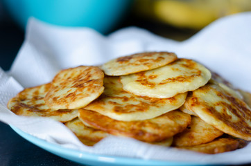 Pancakes with zucchini vegetable and sour cream.
