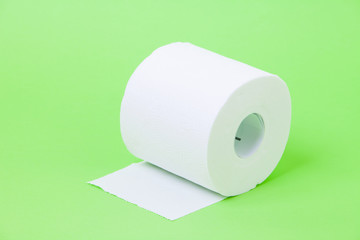 The roll of white toilet eco tissue paper on green background 