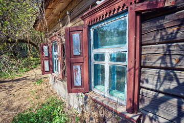 Fototapeta na wymiar ruined old houses in Zalyssia village located in Chernobyl Exclusion zone, popular dark tourism location, Ukraine