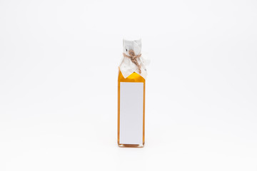 Perill oil in single glass bottle on white background