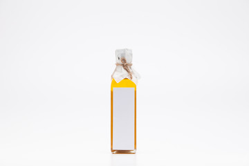 Perill oil in single glass bottle on white background
