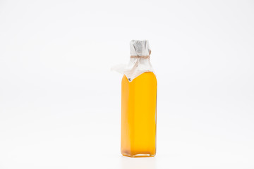 Perill oil in single glass bottle on white background