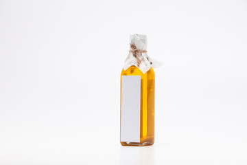 Perill oil in single glass bottle on white background