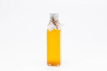 Perill oil in single glass bottle on white background