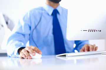Businessman in the office on the phone with headset, Skype, FaceTime