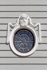 Oval window with a mask of Poseidon