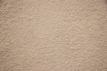 Beige stucco wall texture wide shot