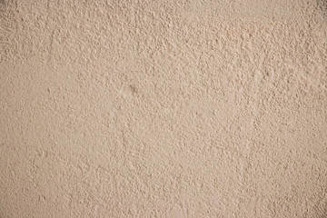 Beige stucco wall texture wide shot