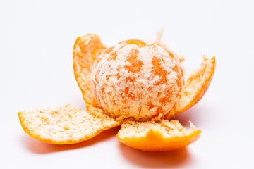 Peeled mandarin oranges on white background 