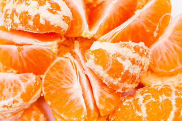 Peeled mandarin oranges on white background 