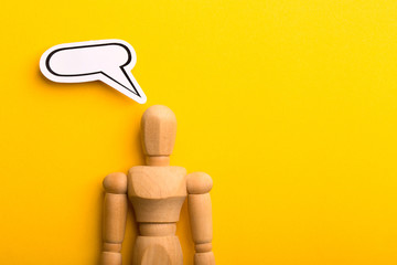 Thinking Concept With Blank Speech Bubble And Wooden Man