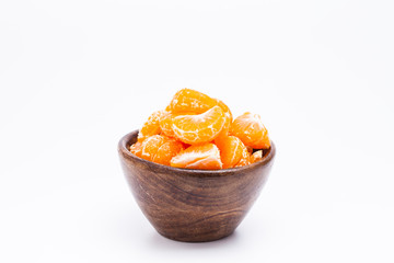 Peeled mandarin orange on wooden bowl