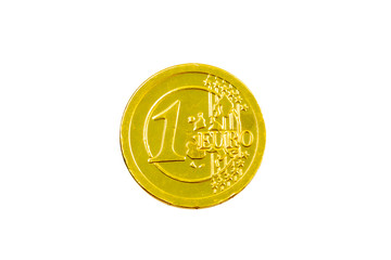 Chocolate candy in the form of 1 euro. Gold foil with an engraving of 1 euro coin. Chocolate euro...