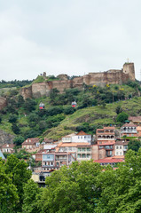 Fototapeta na wymiar Tbilisi, Georgia View with Houses, Narikala Castle and Cableway