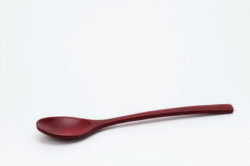 Wooden spoon isolated on white background