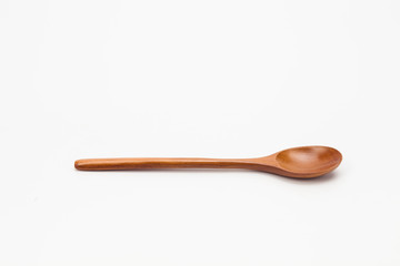 Wooden spoon isolated on white background