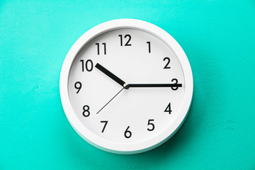 Wall clock at abstract background surface