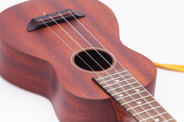  The ukulele guitar isolated on white