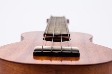  The ukulele guitar isolated on white