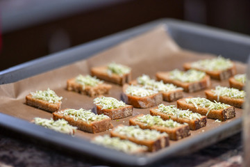 Bread from the oven with seasonings. Cooking delicacies for guests