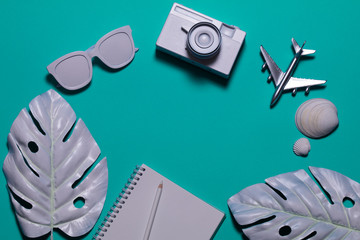 Creative layout with copy space and various summer objects on pastel turquoise background. Minimal vacation concept. Flat lay.