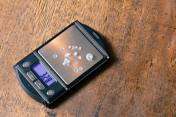 Diamond on the jewelry scales