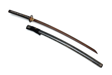 Red blade Japanese sword  black cord with  shiny ray skin wrapped scabbard  isolated in white...
