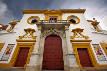 Naklejka premium Front doors and baroque facade of the Plaza de Toros Bull fighting ring in Seville Spain