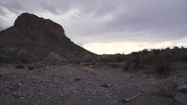 Slow dolly shot forward at the Castolon peak, in a dry rocky desert