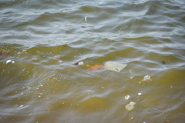 Garbage in the sea with plastic on water surfac dirty sea on the island