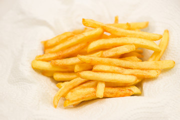 French fries on white paper