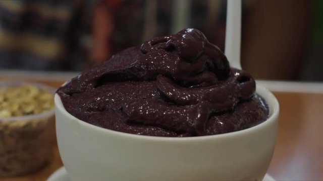 Slow Motion: Some Oats Being Sprinkled Onto a Bowl Full of Chocolate Dessert - Rio de Janeiro, Brazil