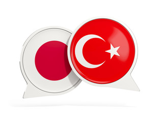 Flags of Japan and turkey inside chat bubbles