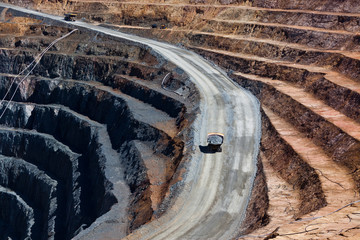 Two trucks transport gold ore from open cast mine. Barrick Cowal Gold Mine in New South Wales, ...