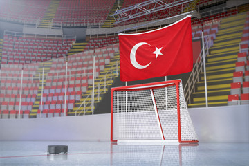 Flag of Turkey in hockey arena with puck and net