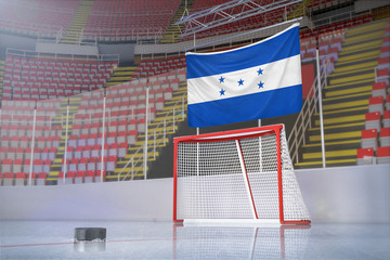 Flag of Honduras in hockey arena with puck and net