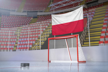 Flag of Poland in hockey arena with puck and net