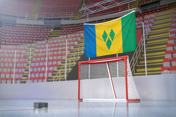 Flag of Saint Vincent and the Grenadines in hockey arena with puck and net