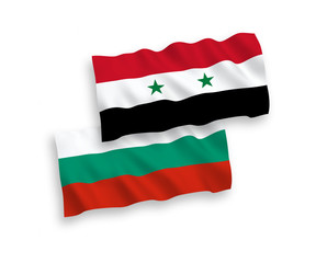 National vector fabric wave flags of Bulgaria and Syria isolated on white background. 1 to 2 proportion.