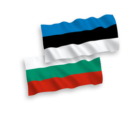 National vector fabric wave flags of Bulgaria and Estonia isolated on white background. 1 to 2 proportion.