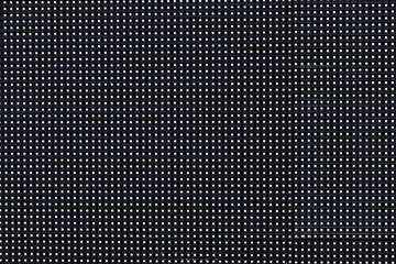 Perforated plastic texture seamless pattern background.