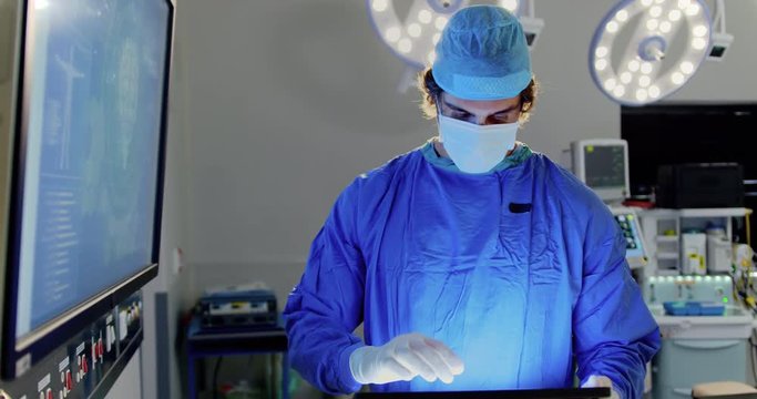 Male surgeon examining x-ray report 4k