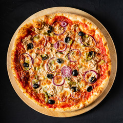 pizza on the black background