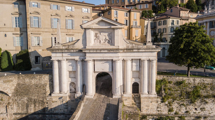 Fototapeta premium Bergamo, Italy. Drone aerial view of the old gate San Giacomo and historical building. The Old town. One of the beautiful city in Italy