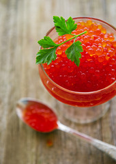 Glass with delicious red caviar