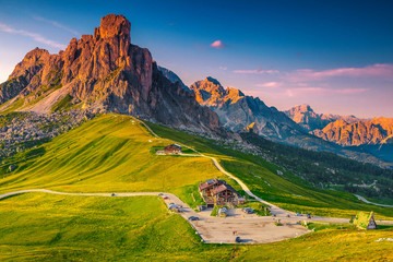 Stunning alpine pass with high mountains at sunset, Dolomites, Italy