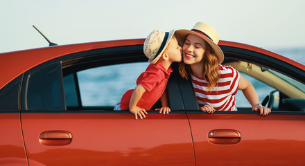 happy family mother and child boy goes to summer travel trip in car.