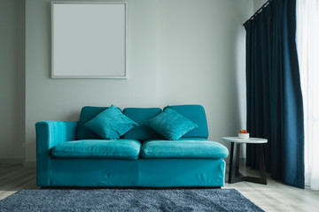blue coral fabric color sofa in white living room interior home design concept