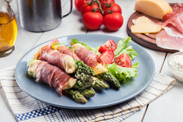 Baked prosciutto and cheese wrapped asparagus