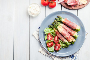 Baked prosciutto and cheese wrapped asparagus